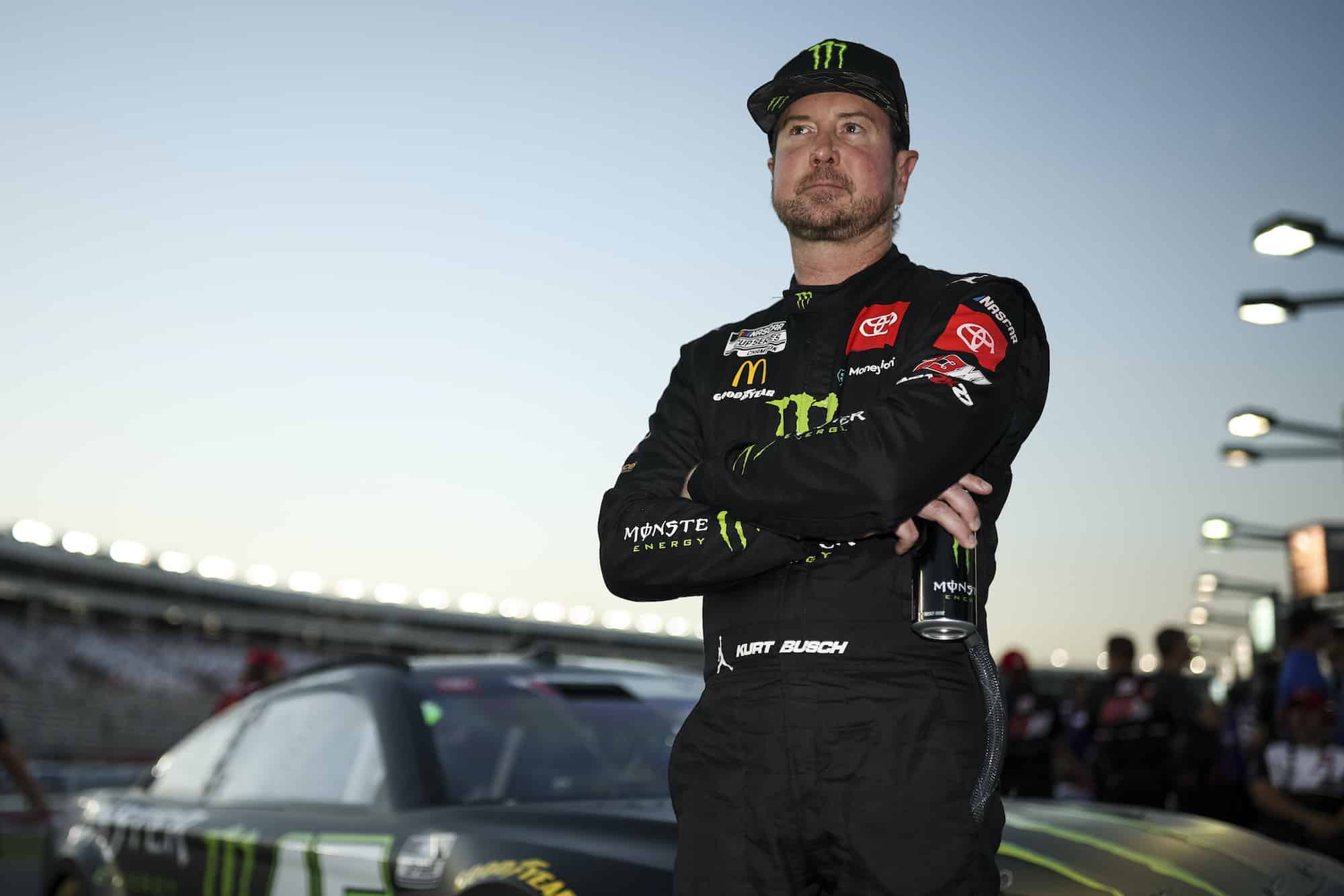 Kurt Busch looks on from grid