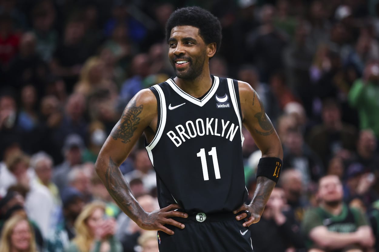 Kyrie Irving smiles during a game against the Celtics.