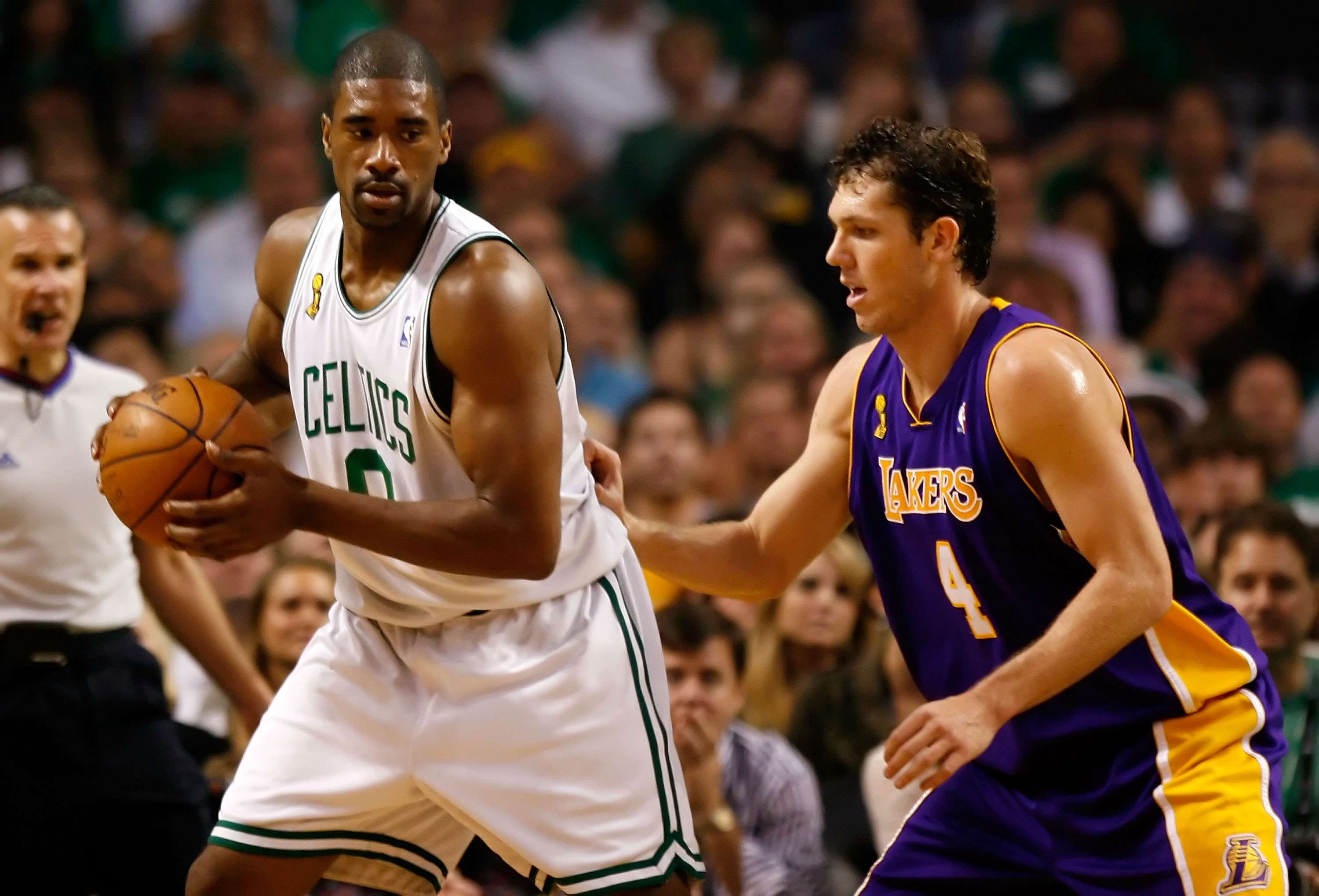 Leon Powe of the Boston Celtics posts up Luke Walton of the Los Angeles Lakers.