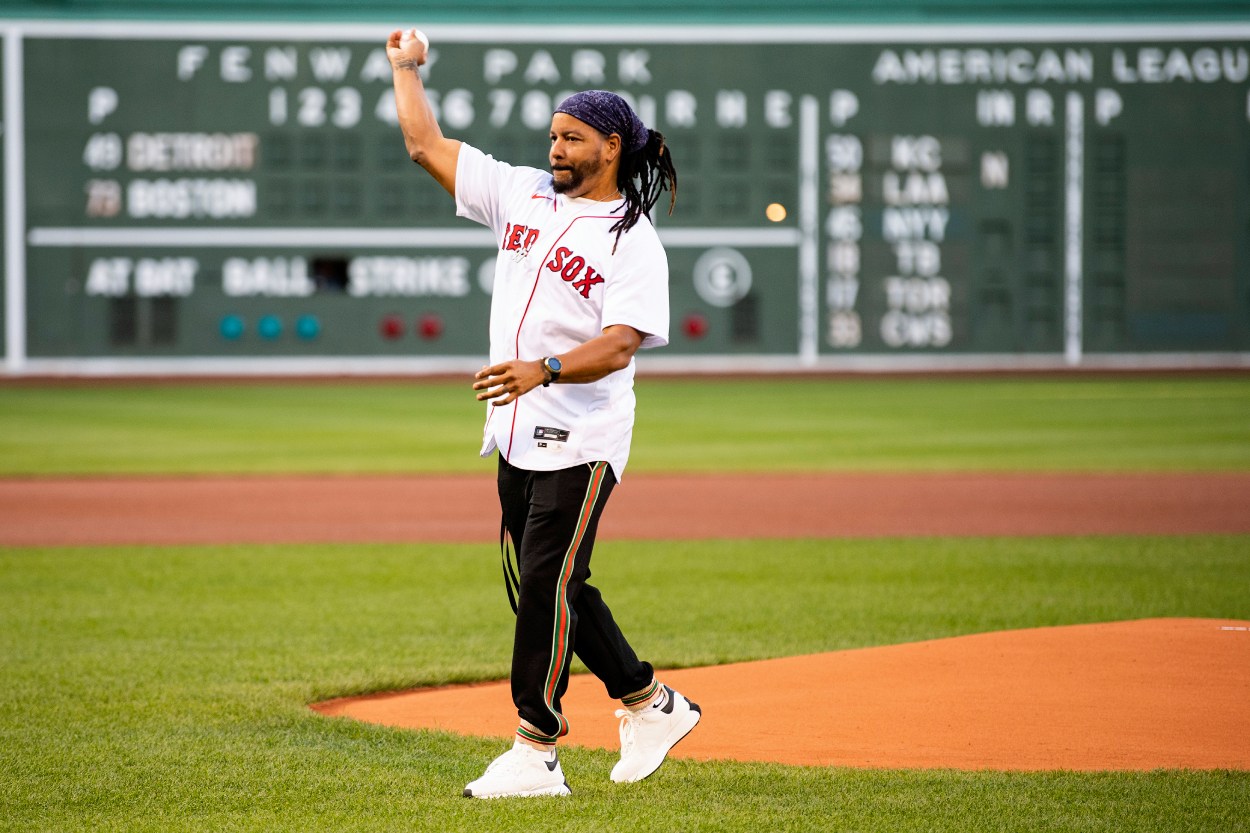Former left fielder Manny Ramirez of the Boston Red Sox throws out a ceremonial first pitch.