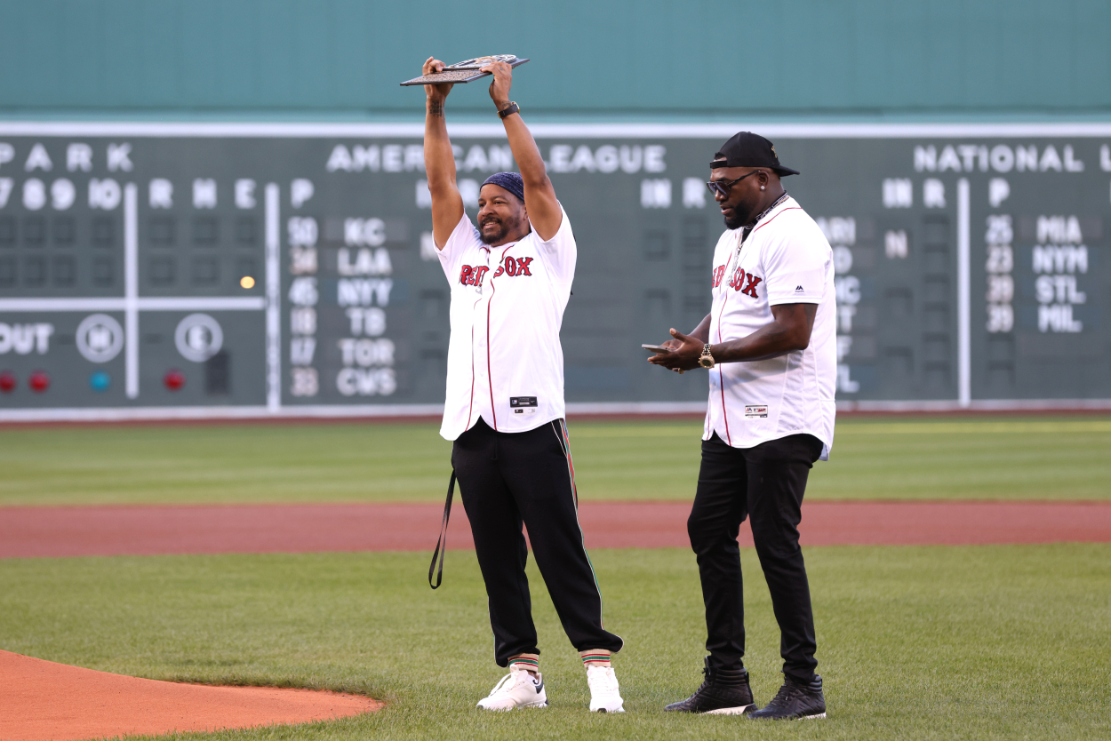 Boston Red Sox Hall of Famer Manny Ramirez is presented a plaque by Hall of Famer David Ortiz before a game against the Detroit Tigers at Fenway Park on June 20, 2022, in Boston, Massachusetts.