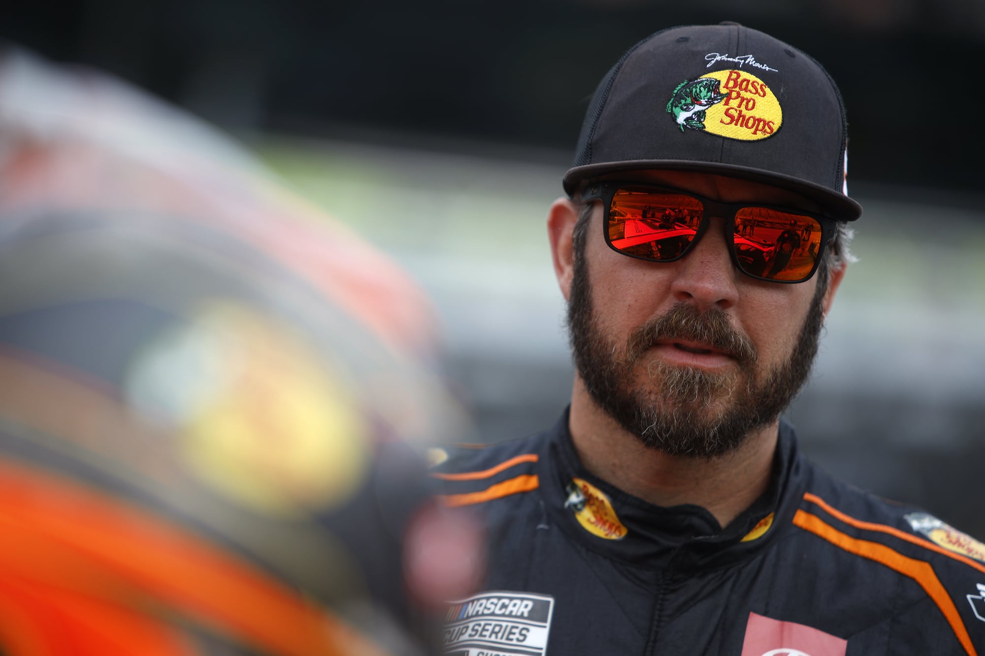 Martin Truex Jr. looks on before practice