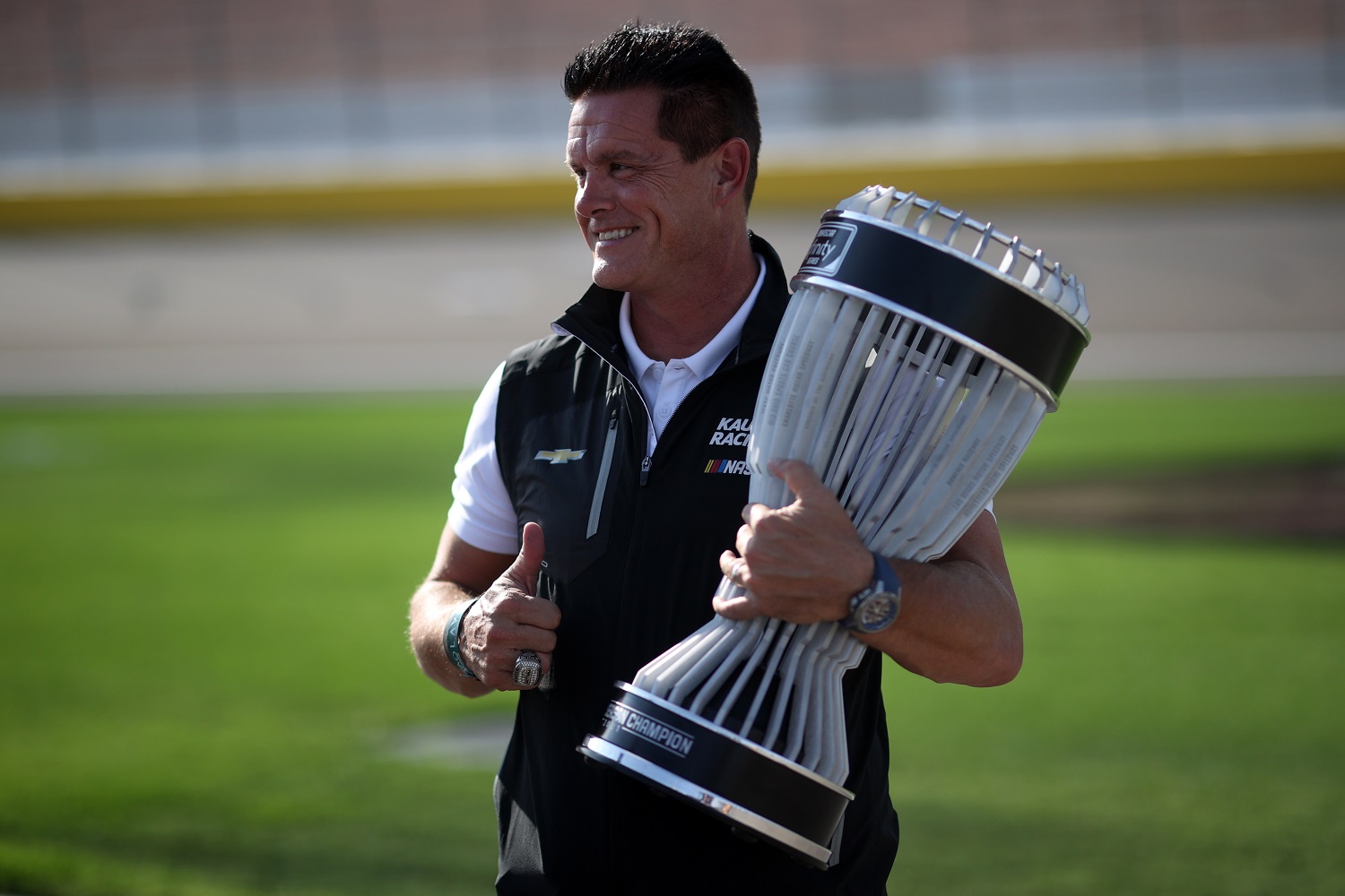 Matt Kaulig, owner of Kaulig Racing, poses with the 2021 NASCAR Xfinity Series regular-season championship trophy prior to the NASCAR Xfinity Series Alsco Uniforms 302 at Las Vegas Motor Speedway on Sept. 25, 2021.
