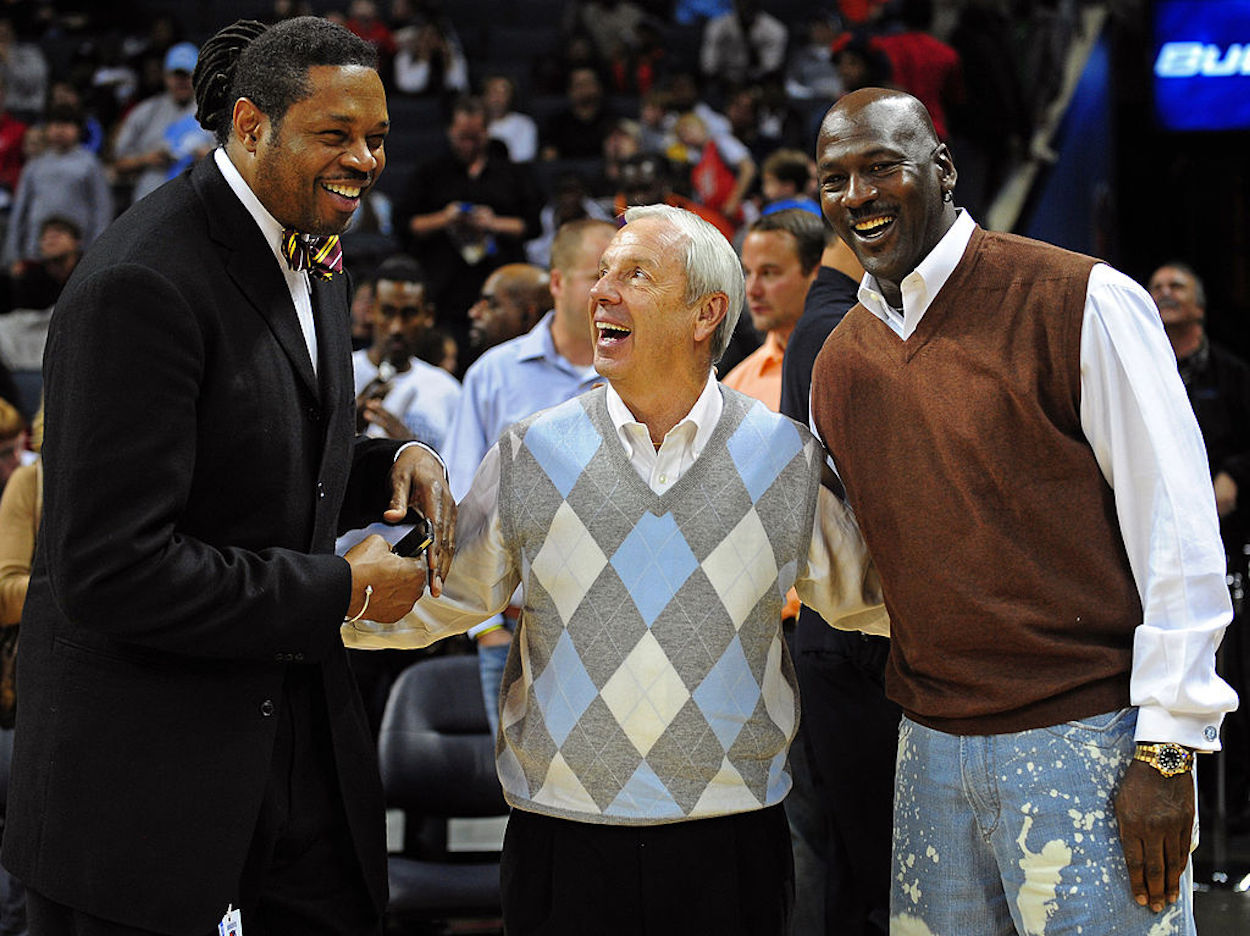 Sam Perkins (L), Roy Williams (C) and Michael Jordan (R) pose together.