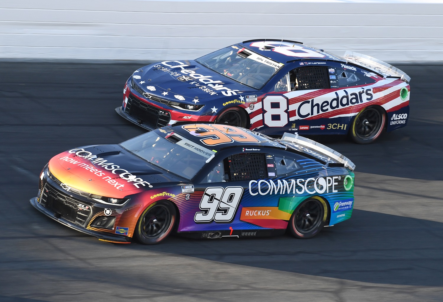 Daniel Suarez and Tyler Reddick race through Turn 4 during the running of the NASCAR Cup Series Coca-Cola 600 on May 29, 2022, at Charlotte Motor Speedway.