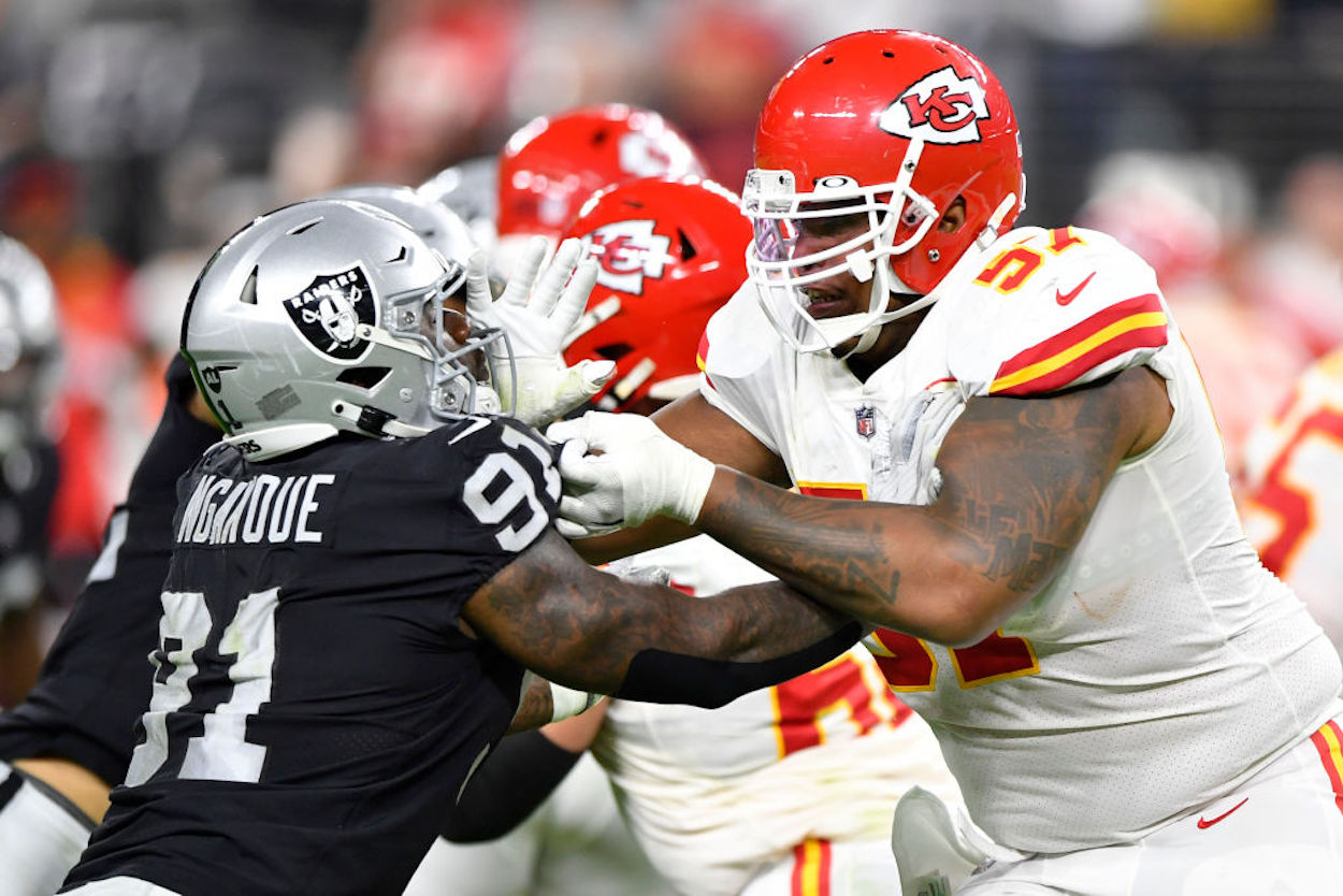Offensive lineman Orlando Brown Jr. (R) blocks an opponent during a Chiefs game.