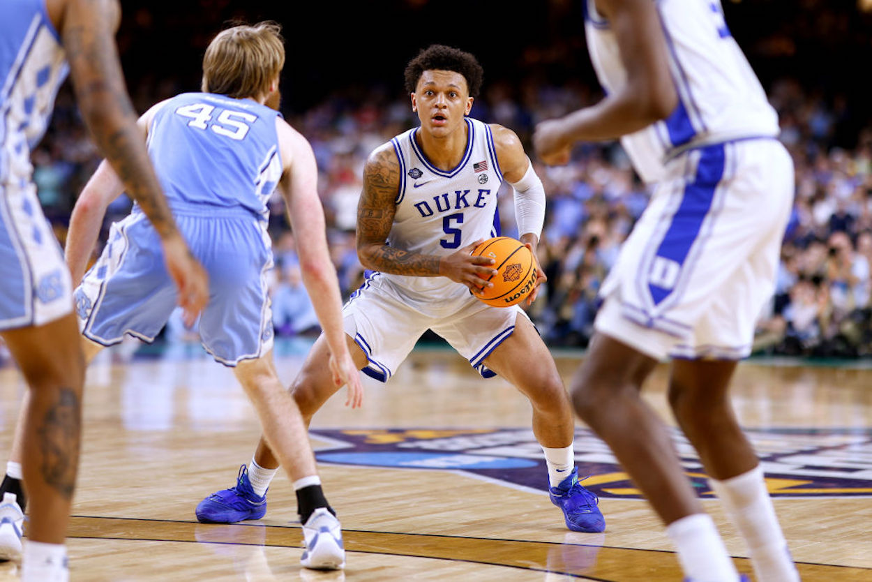 Paolo Banchero holds the ball for Duke against North Carolina.
