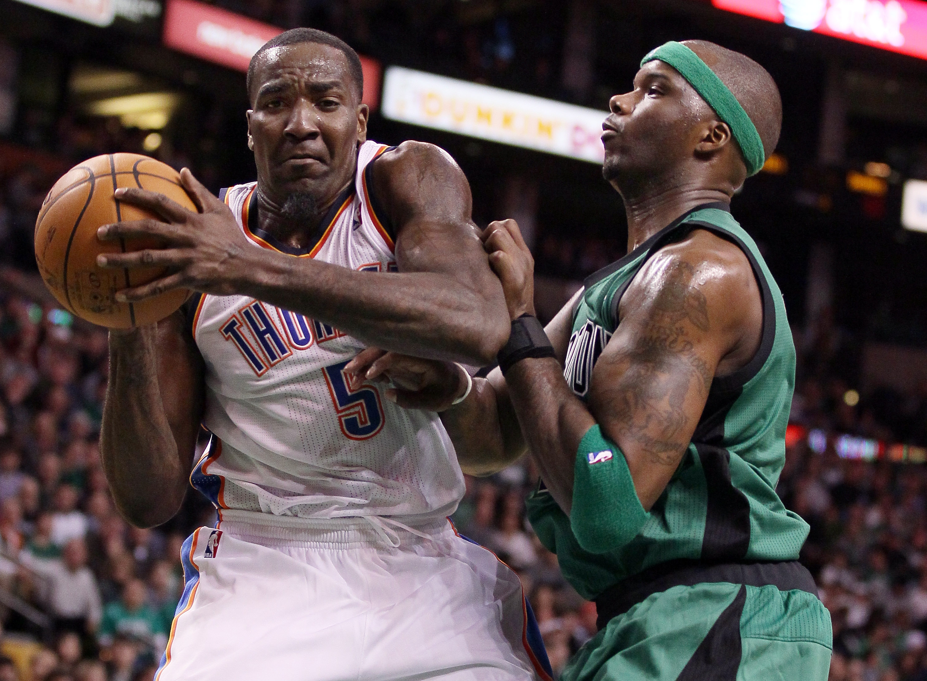 Kendrick Perkins, left, of the Oklahoma City Thunder heads to the net as Jermaine O'Neal of the Boston Celtics defends.