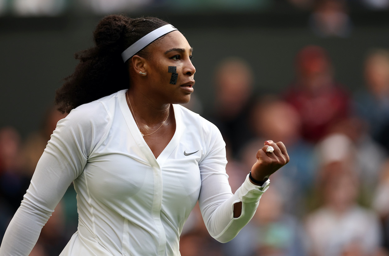 Serena Williams celebrates after winning a point at Wimbledon 2022.