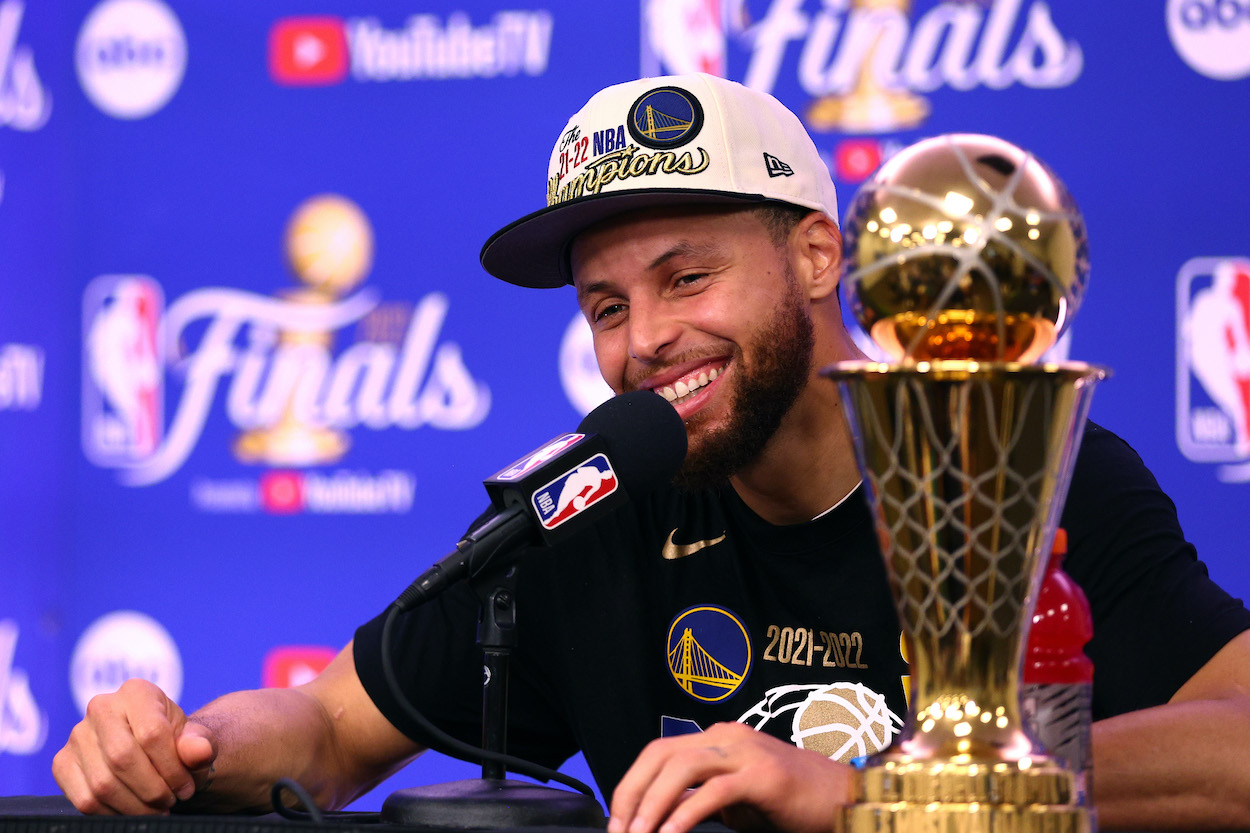 Stephen Curry of the Golden State Warriors speaks to the media after winning the 2022 NBA Finals. Bill Simmons moved Curry into his top 10 'pantheon' NBA players of all time.