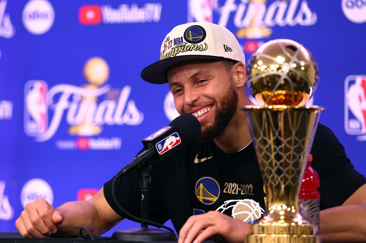 Stephen Curry of the Golden State Warriors speaks to the media after winning the 2022 NBA Finals. Bill Simmons moved Curry into his top 10 'pantheon' NBA players of all time.