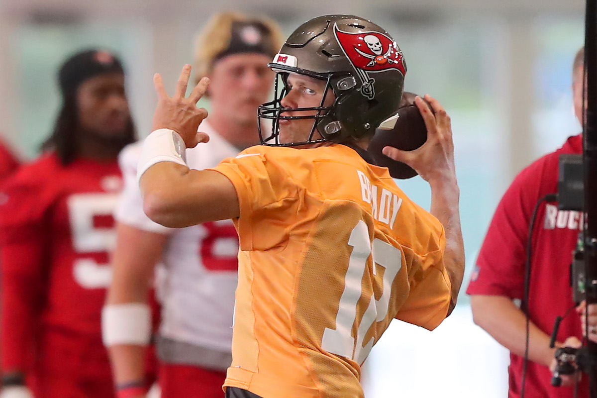 Tampa Bay Buccaneers quarterback Tom Brady goes through a drill during minicamp