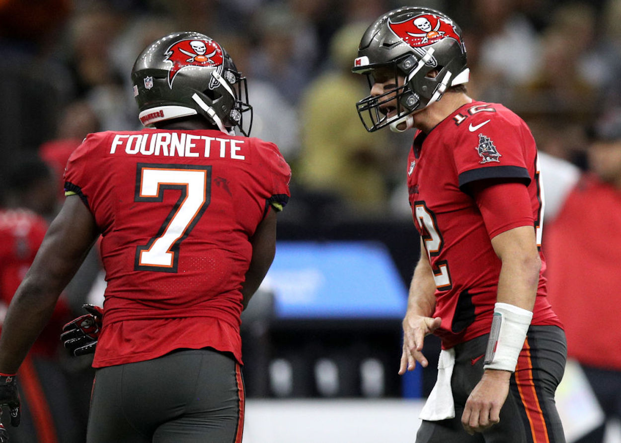 Leonard Fournette and Tom Brady exchange words during a Tampa Bay Buccaneers game.