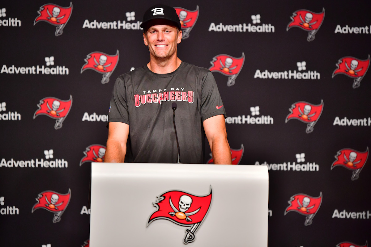 Tom Brady of Tampa Bay Buccaneers answers questions at a press conference following the 2022 Buccaneers minicamp