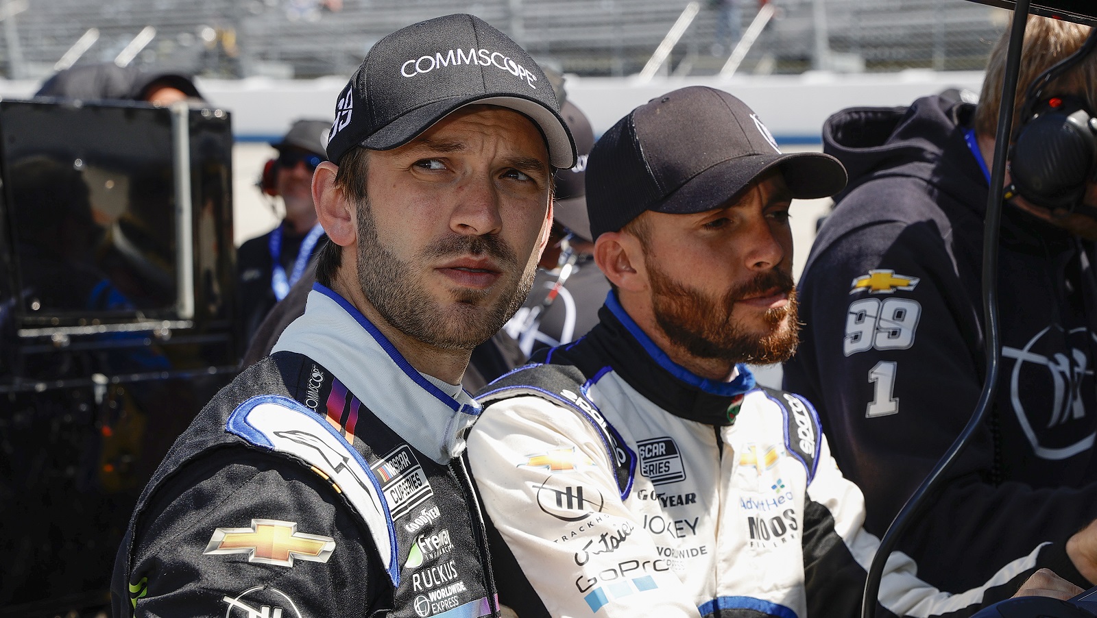 Daniel Suarez and Ross Chastain of Trackhouse Racing wait on the grid during qualifying for the DuraMAX Drydene 400 at Dover Motor Speedway on April 30, 2022.