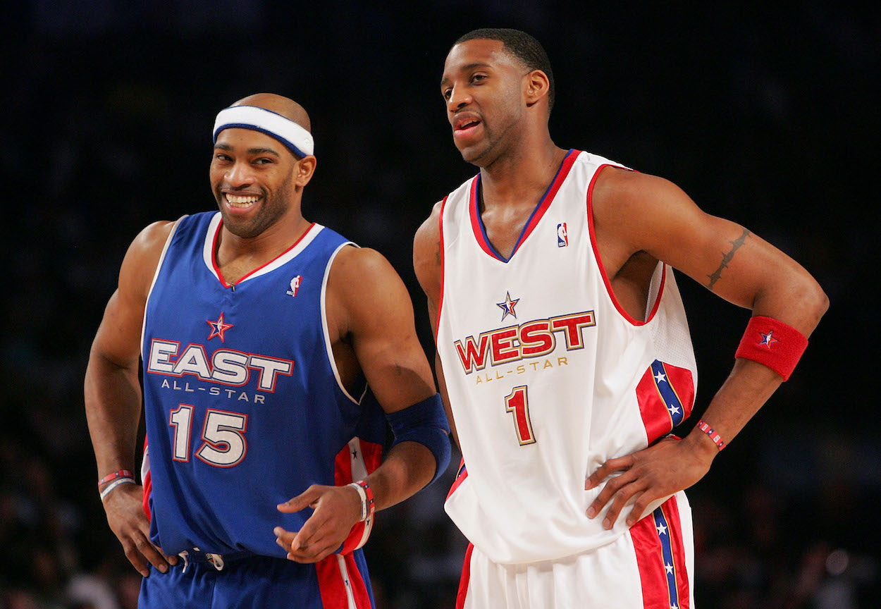 Vince Carter laughs with Tracy McGrady.