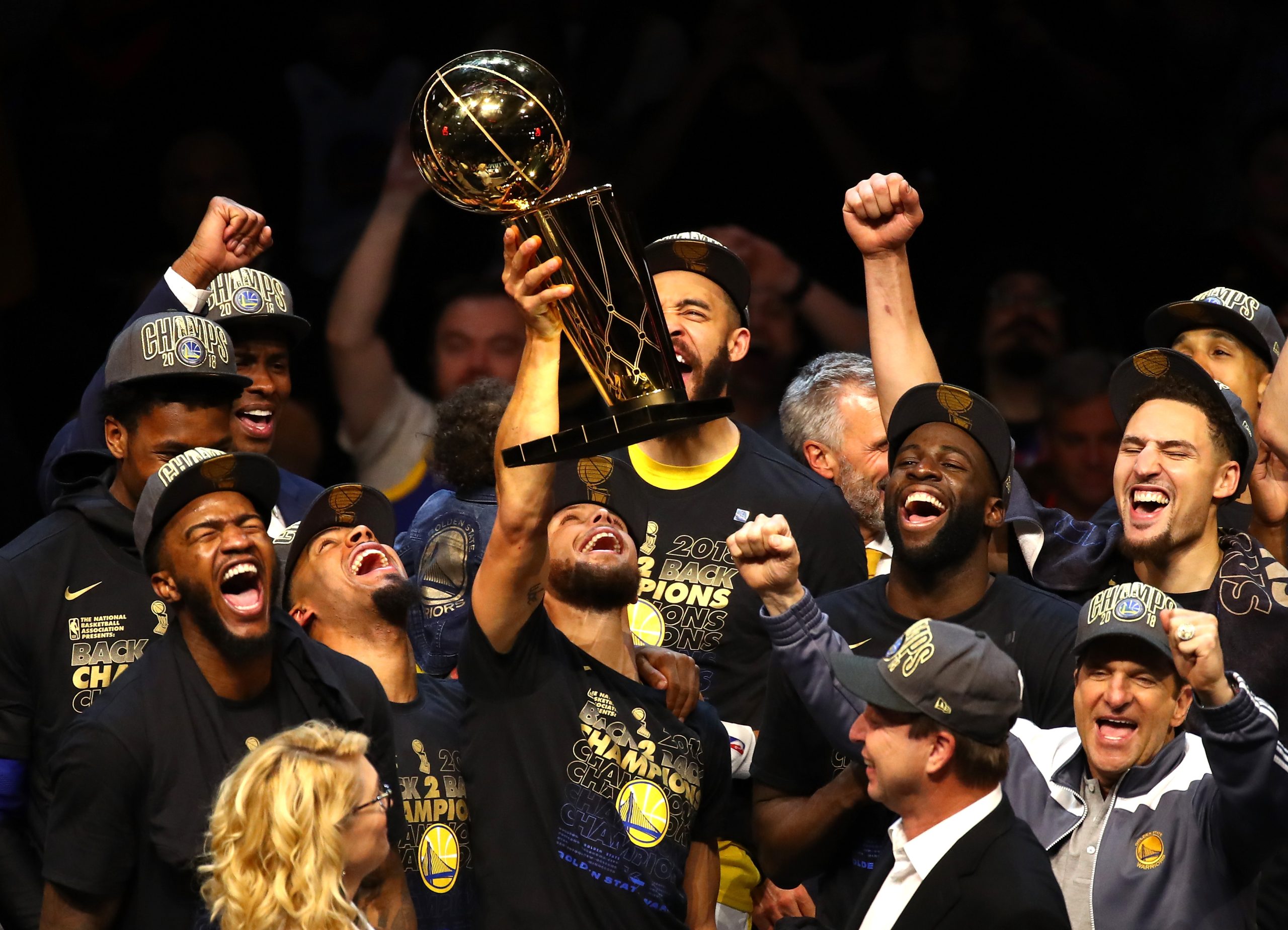 Stephen Curry of the Golden State Warriors celebrates with the Larry O'Brien Trophy.