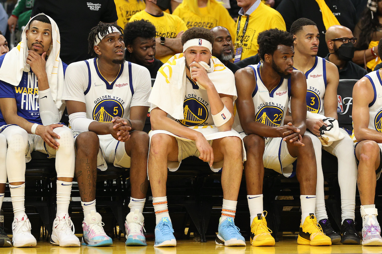 The Warriors look on from the bench during the NBA Finals.