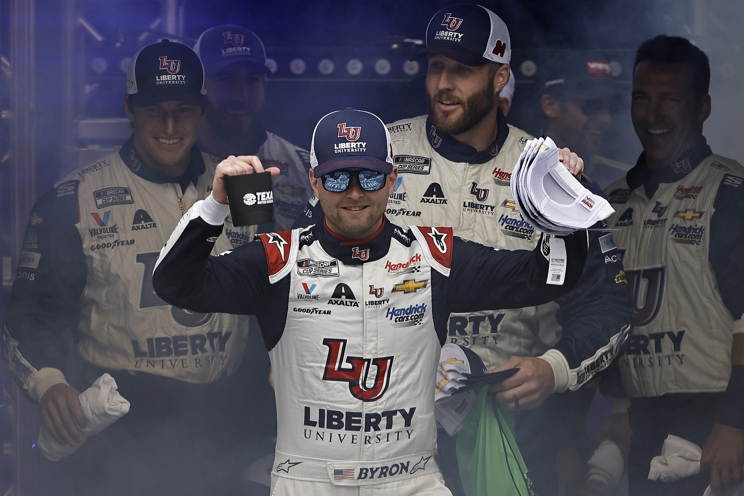 William Byron and crew walk onstage during driver intros prior to the NASCAR Cup Series All-Star Race at Texas Motor Speedway on May 22, 2022.