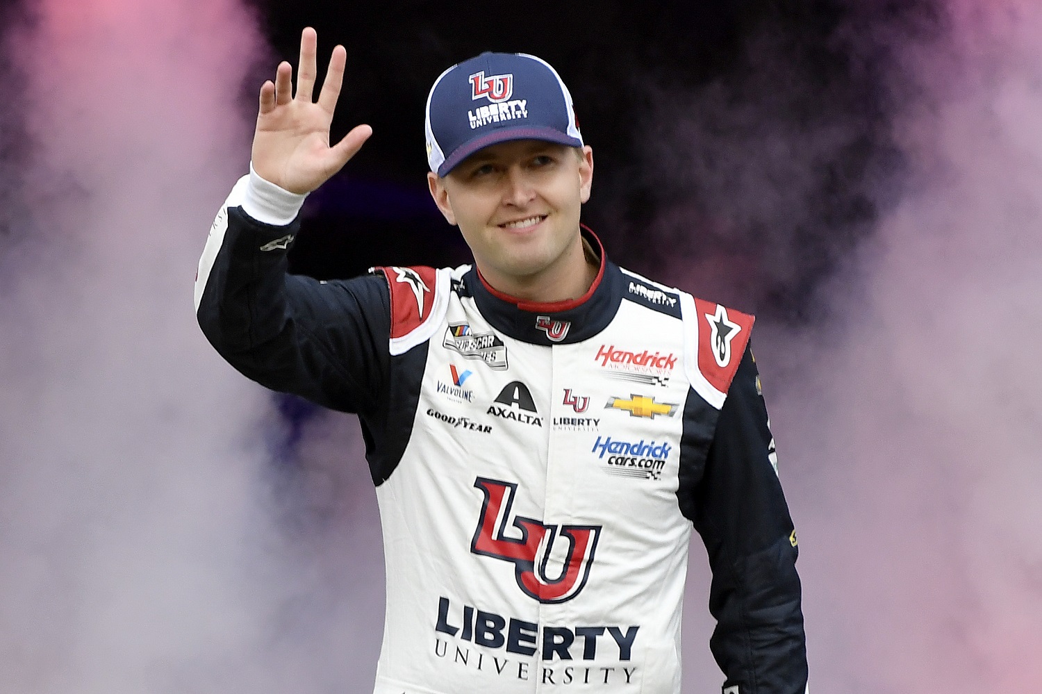 William Byron waves to fans during driver intros prior to the NASCAR Cup Series Food City Dirt Race at Bristol Motor Speedway on April 17, 2022.