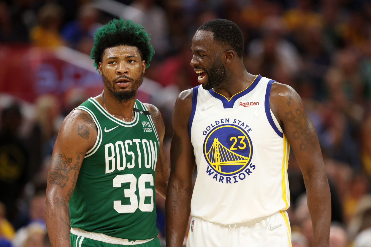 Draymond Green, right, of the Golden State Warriors talks to Marcus Smart of the Boston Celtics.