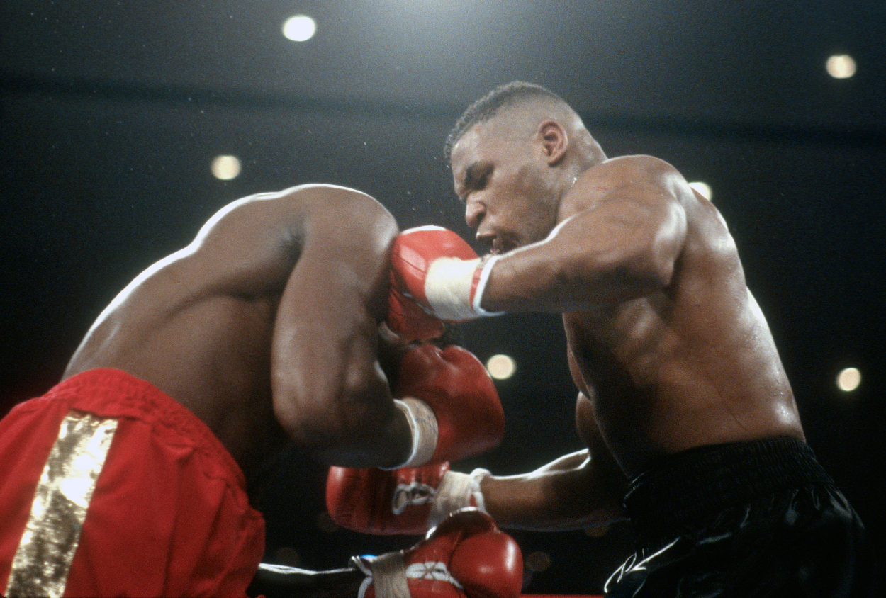 Mike Tyson and Frank Bruno fight for the WBC, WBA and IBF Heavyweight titles on February 25, 1989.