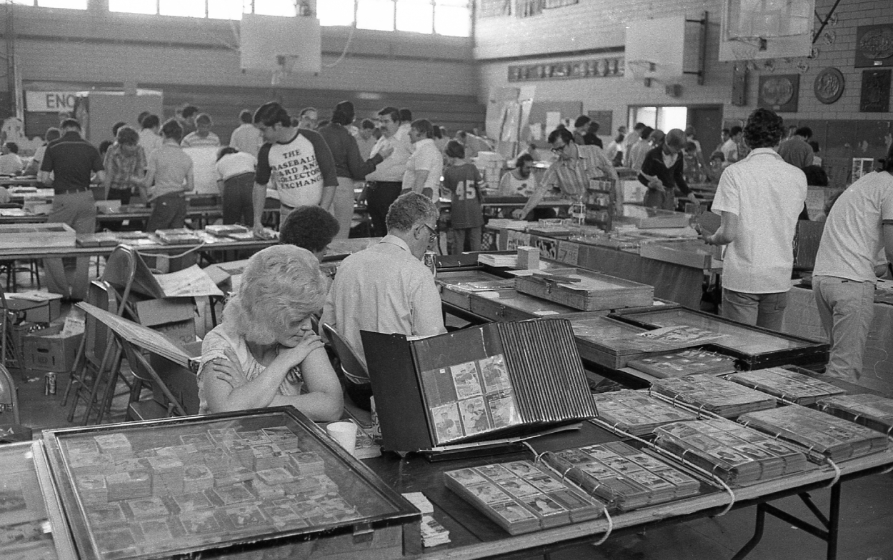 View of vendor tables filled with trading cards and other items.