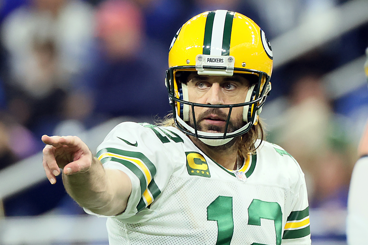 Green Bay Packers quarterback Aaron Rodgers signals before a play.