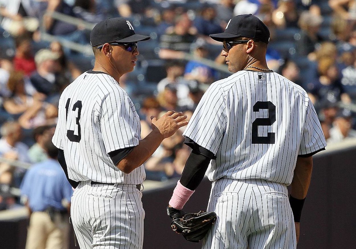 Alex Rodriguez (L) and Derek Jeter (R) talk during a New York Yankees game.