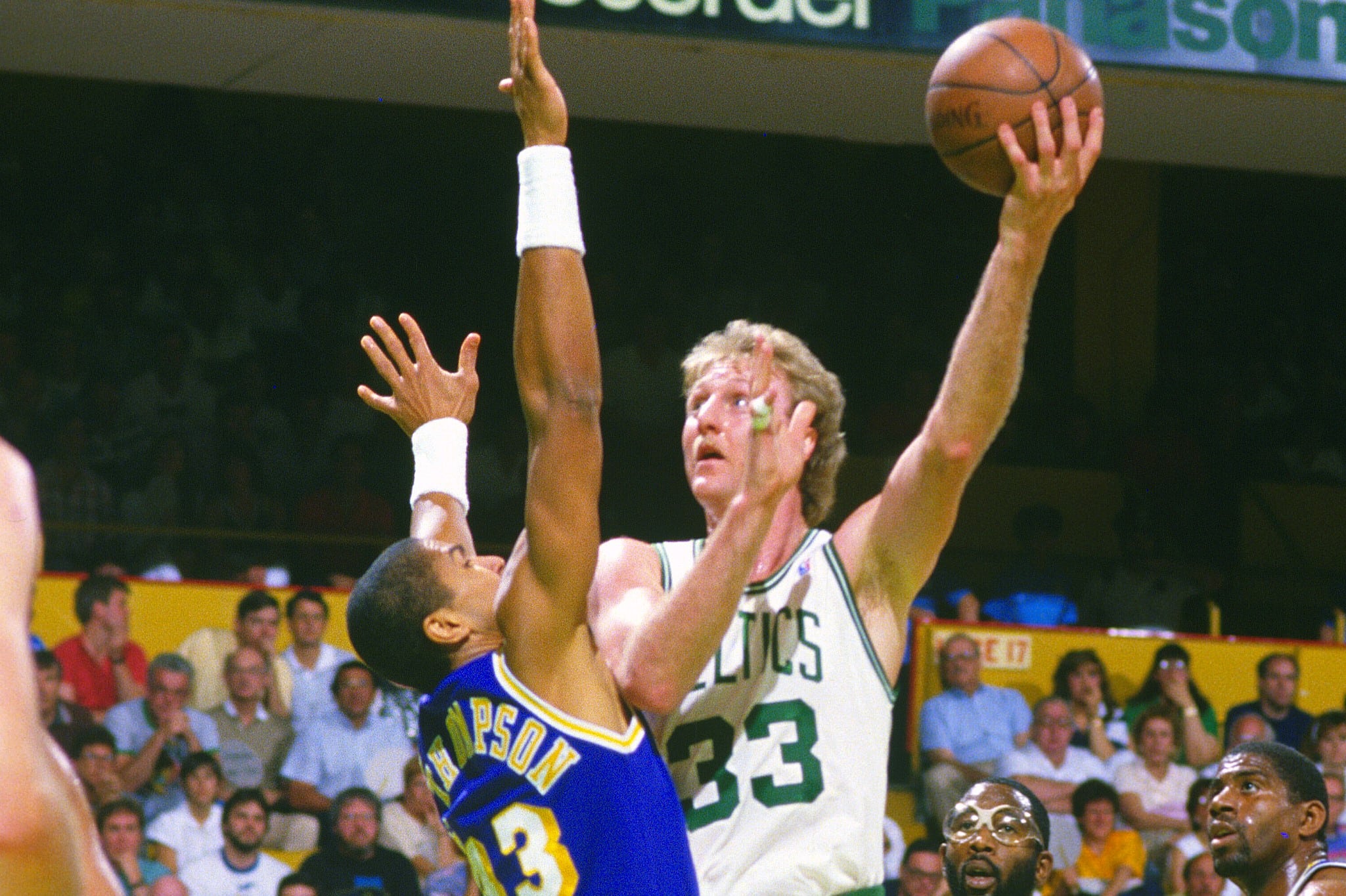 Larry Bird of the Boston Celtics shoots over Mychal Thompson of the Los Angeles Lakers.