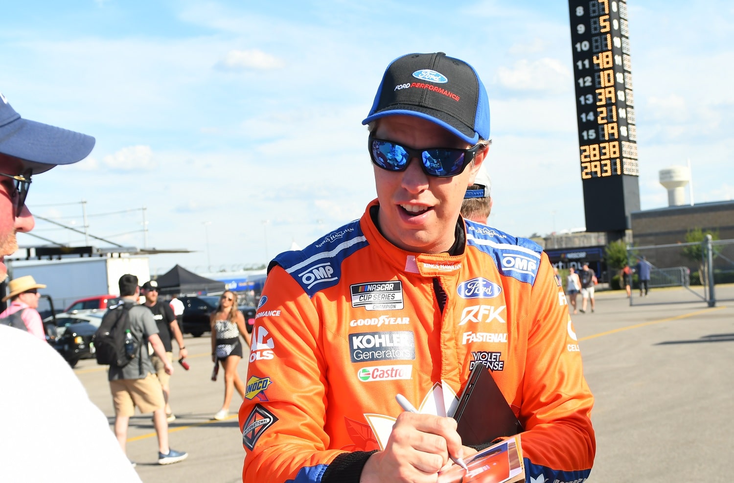 Brad Keselowski signs autographs during practice for the running of the NASCAR Cup Series Ally 400 on June 24, 2022, at Nashville Superspeedway.