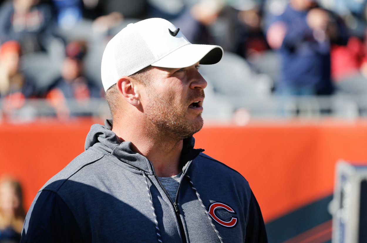 Former Chicago Bears player Brian Urlacher stands on the field prior to a game against the Los Angeles Chargers at Soldier Field.