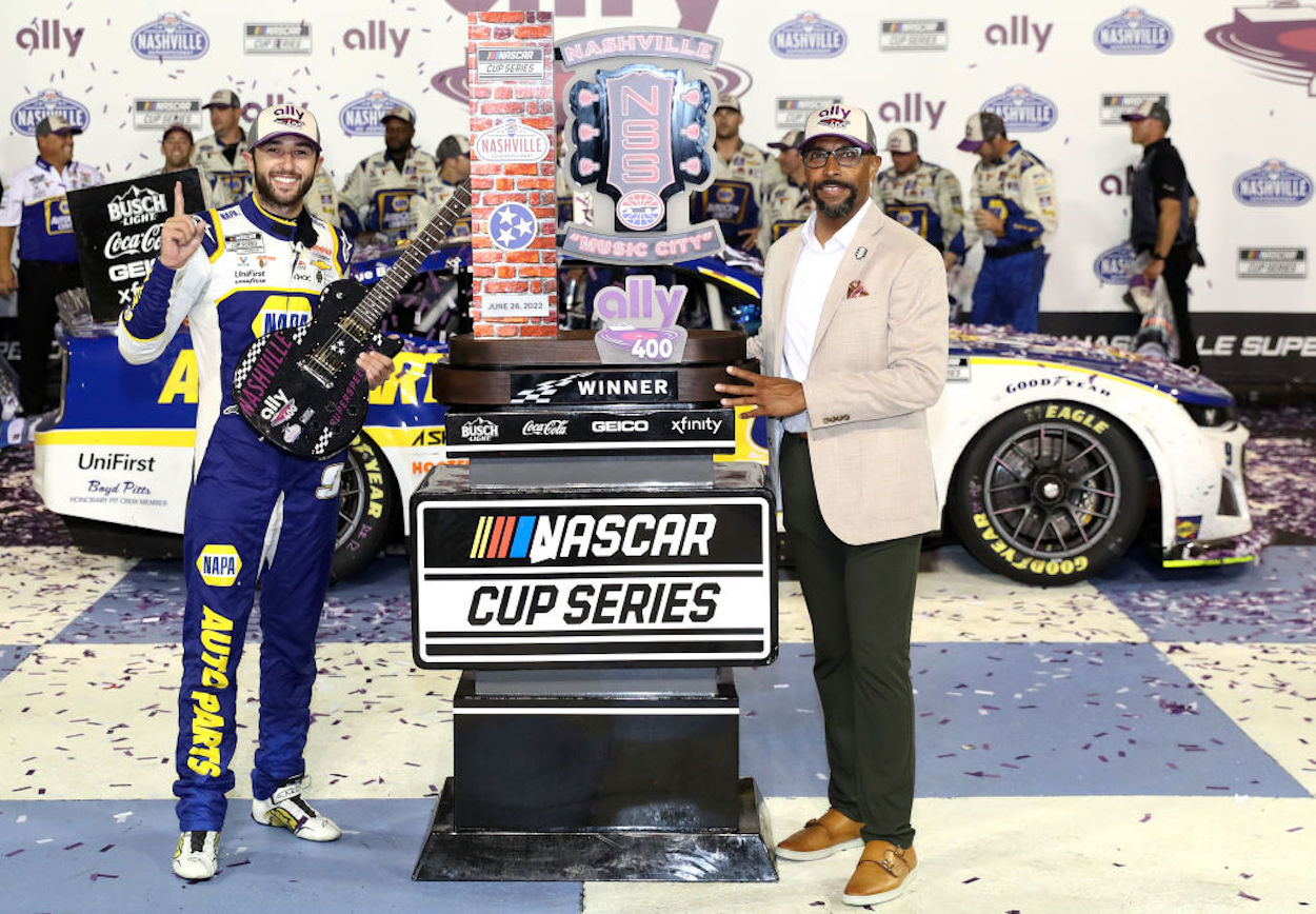Chase Elliott poses with his trophy after winning the NASCAR Cup Series Ally 400.