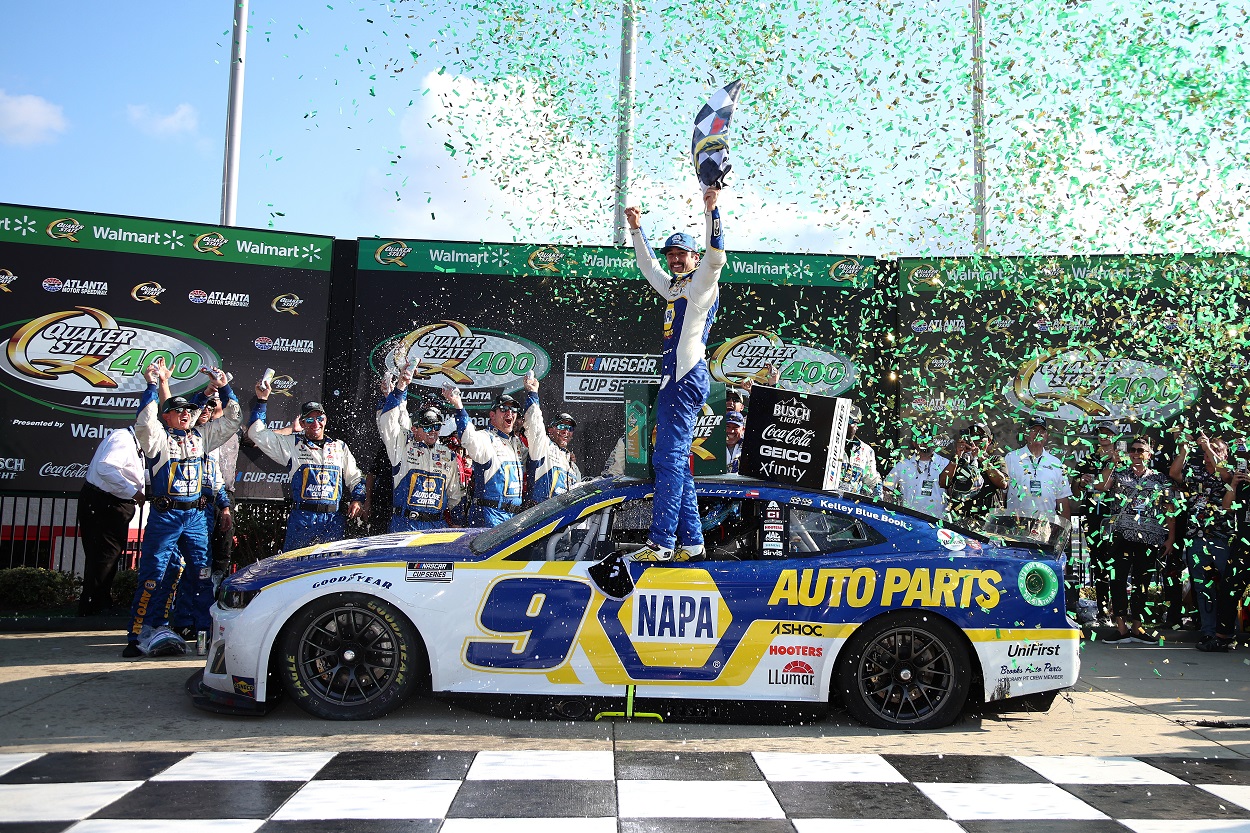 Chase Elliott and crew celebrate his win at the 2022 NASCAR Cup Series Quaker State 400 at Atlanta Motor Speedway