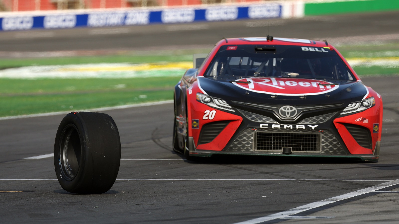 Christopher Bell loses a wheel from the No. 20 Toyota after a pit stop during the NASCAR Cup Series Quaker State 400 at Atlanta Motor Speedway on July 10, 2022.