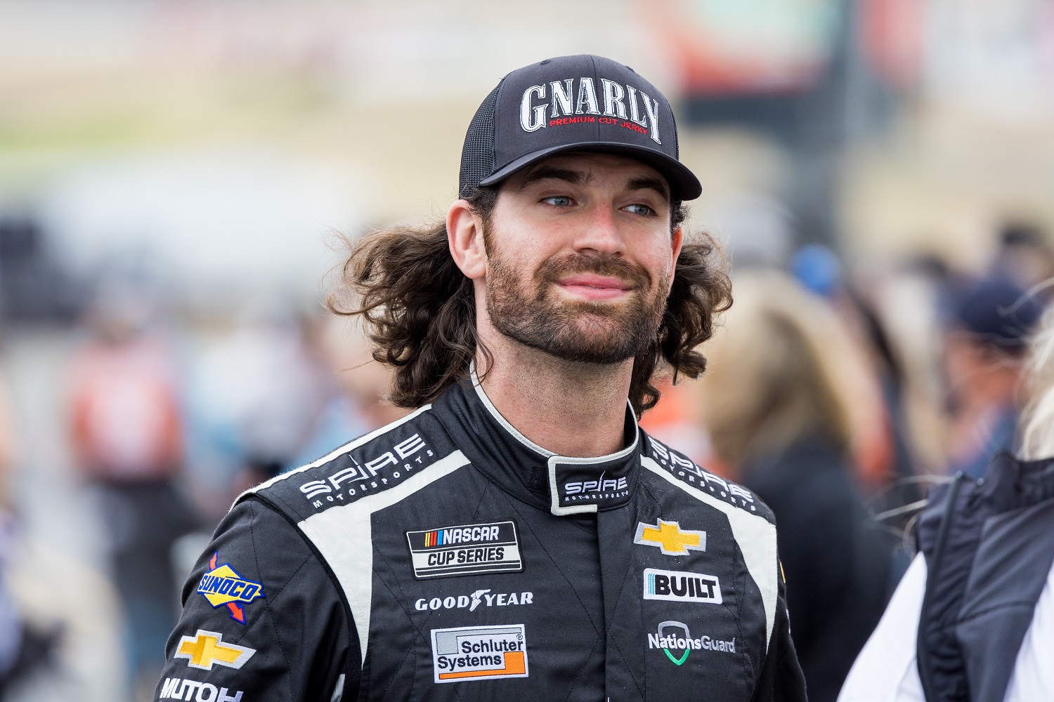 Corey LaJoie walks toward the stage before the NASCAR Cup Series Toyota/Save Mart 350 on June 12, 2022 at the Sonoma Raceway.