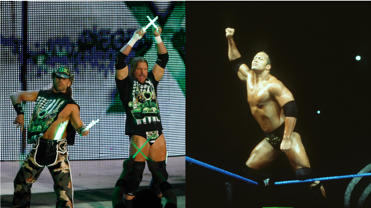 Triple H and Shawn Michaels (L) of WWE's D-Generation X (DX) and Dwayne "The Rock" Johnson (R) in the ring.