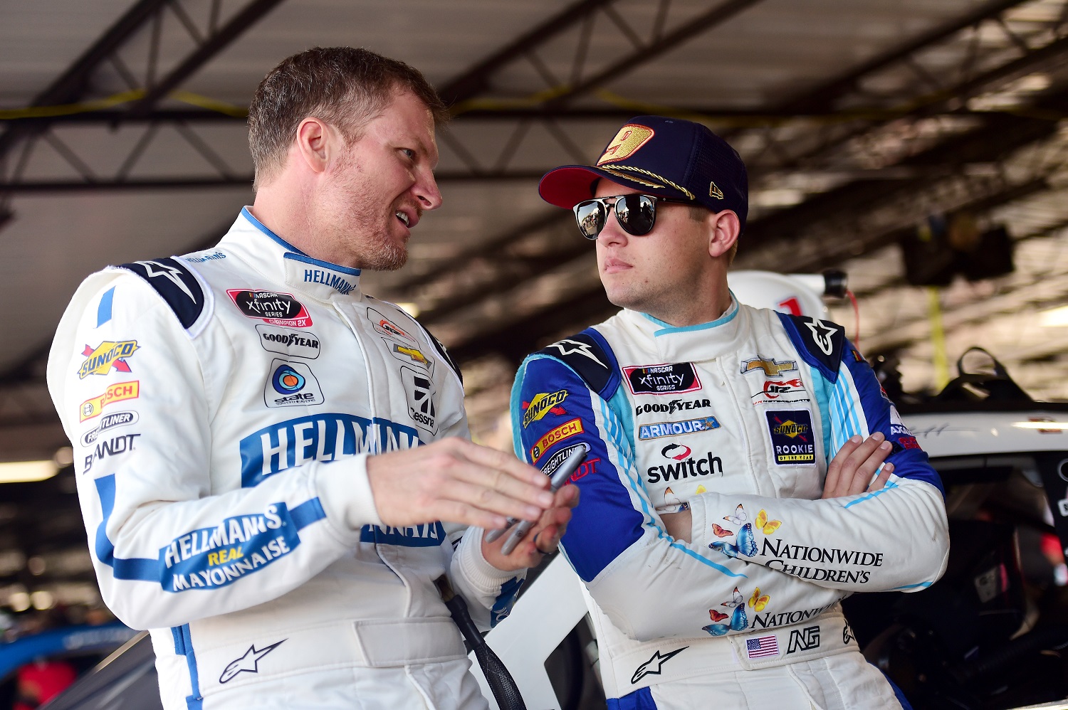 Dale Earnhardt Jr. and Noah Gragson speak in the garage during practice for the NASCAR Xfinity Series Sport Clips Haircuts VFW 200 at Darlington Raceway on Aug. 30, 2019. | Jared C. Tilton/Getty Images