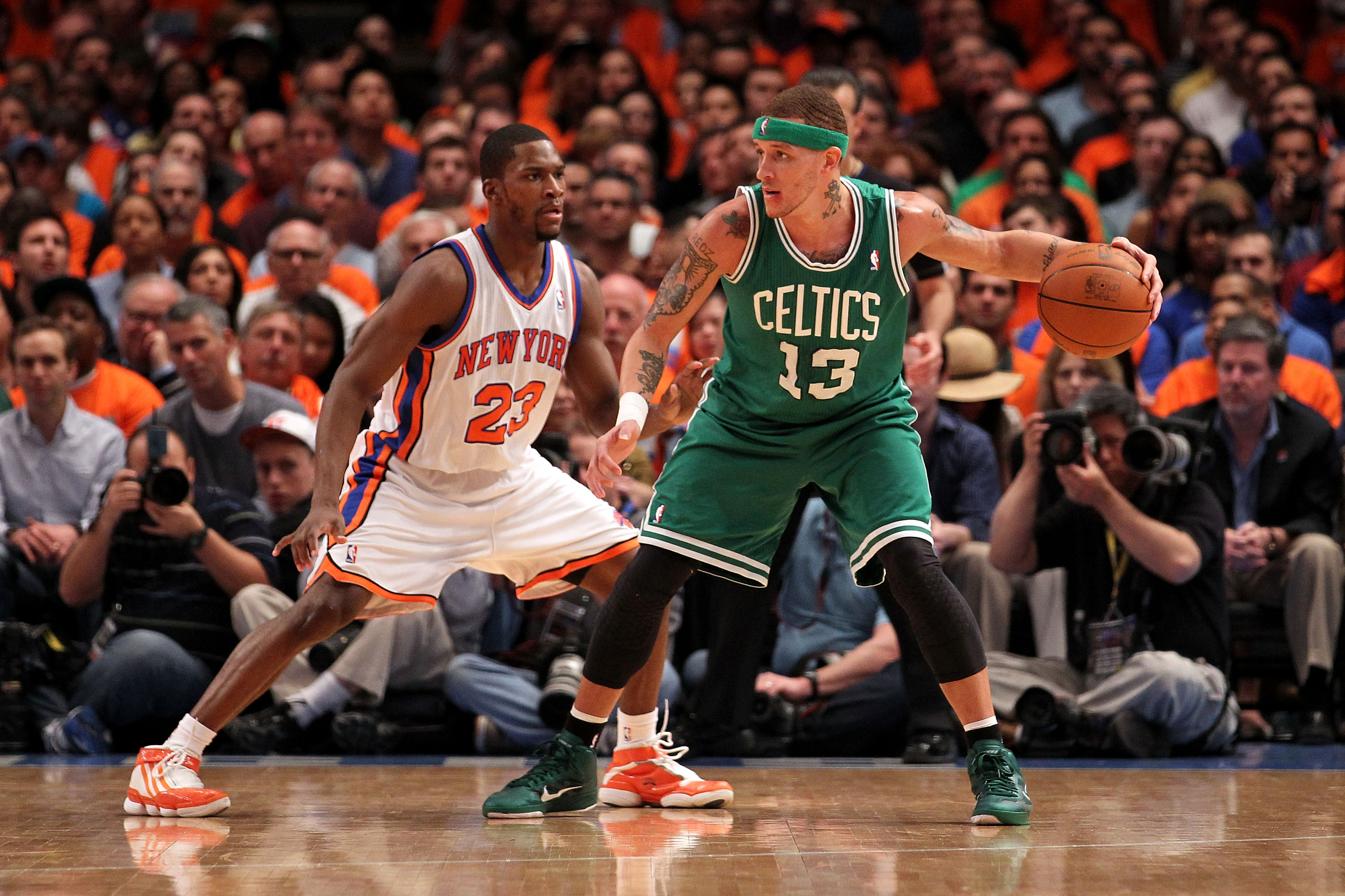 Delonte West of the Boston Celtics looks to pass against Toney Douglas of the New York Knicks.
