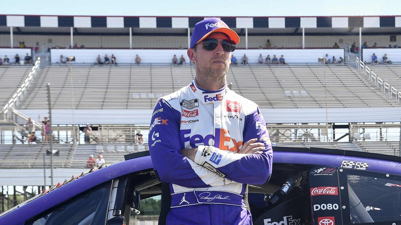 Denny Hamlin looks on during qualifying for the NASCAR Cup Series M&M's Fan Appreciation 400 at Pocono Raceway on July 23, 2022.