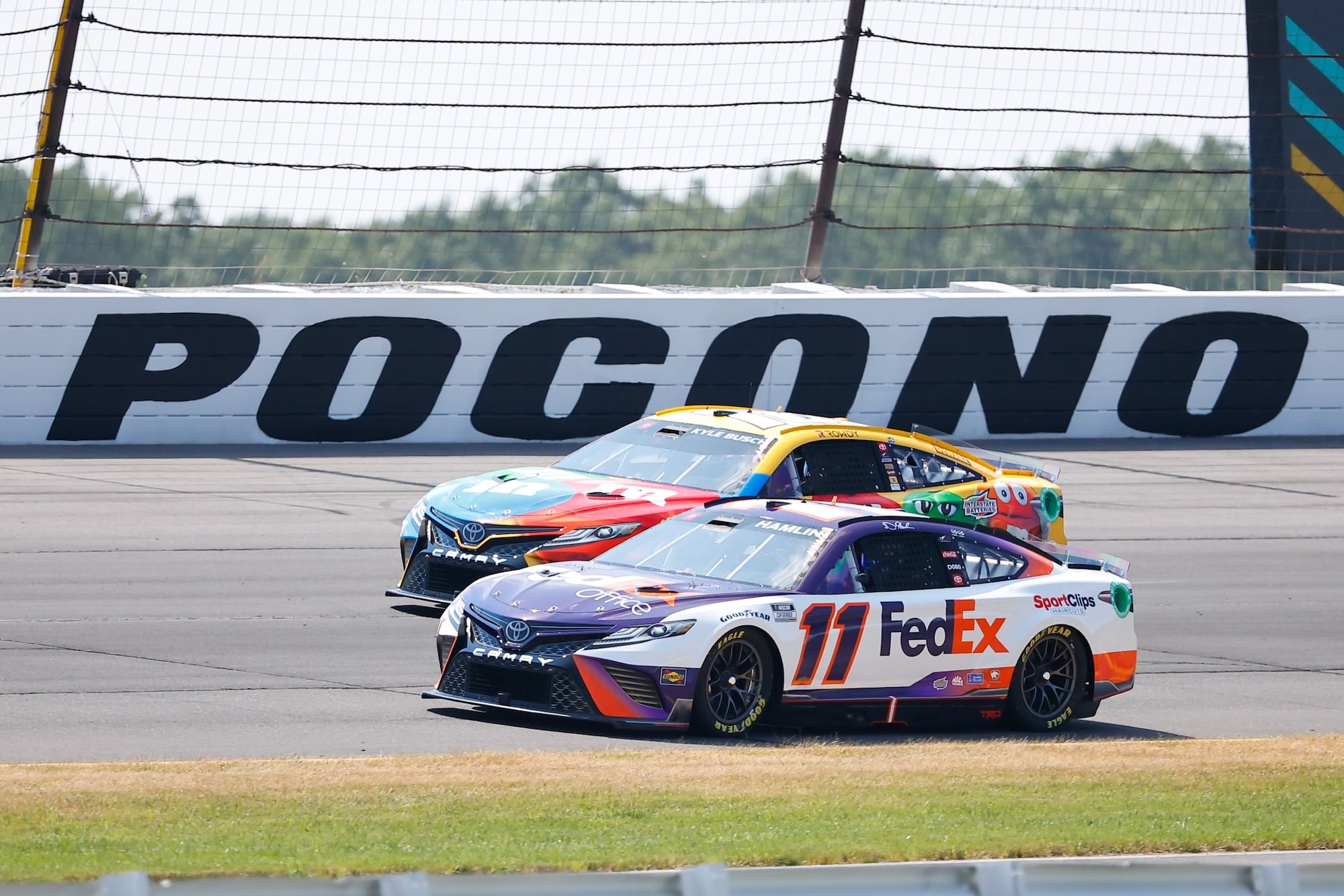 Denny Hamlin and Kyle Busch race