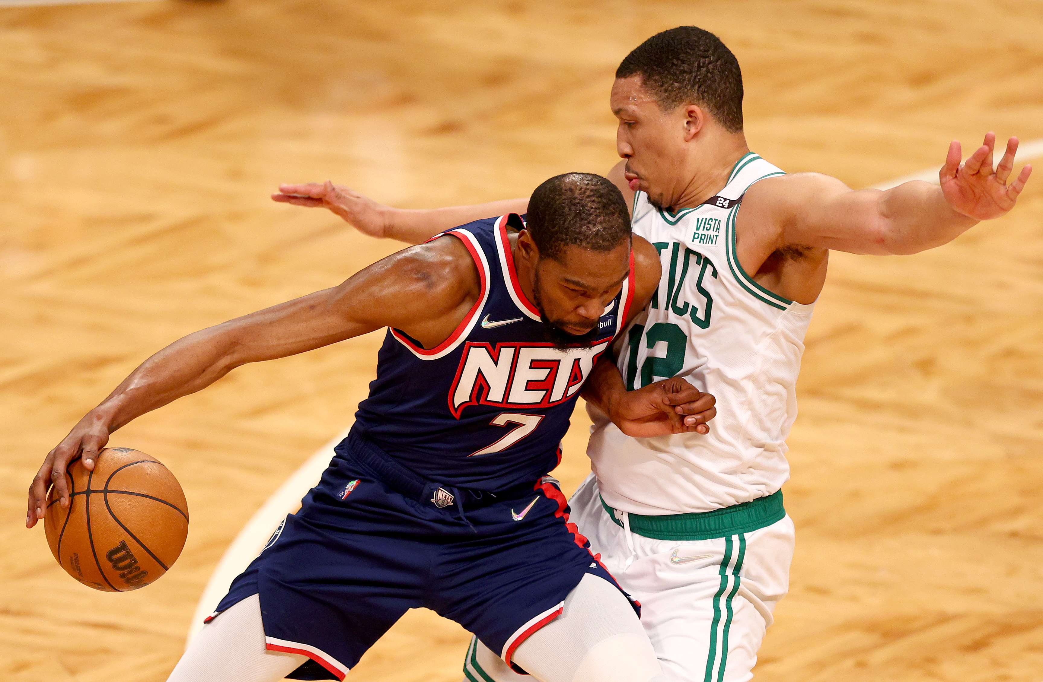 Kevin Durant of the Brooklyn Nets drives as Grant Williams of the Boston Celtics defends.