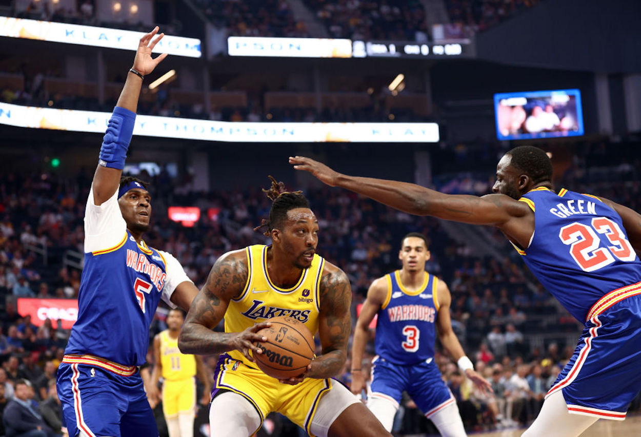Los Angeles Lakers big man Dwight Howard surrounded by defenders.