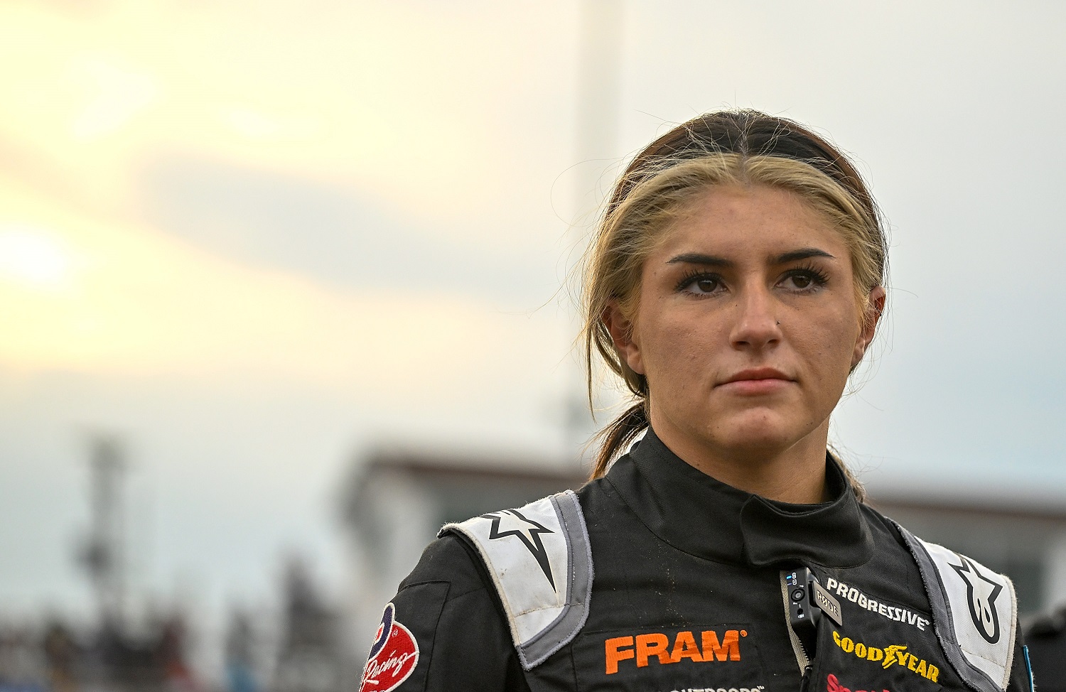 Hailie Deegan looks on during a heat race at a Camping World Superstar Racing Experience at I-55 Raceway on July 16, 2022.
