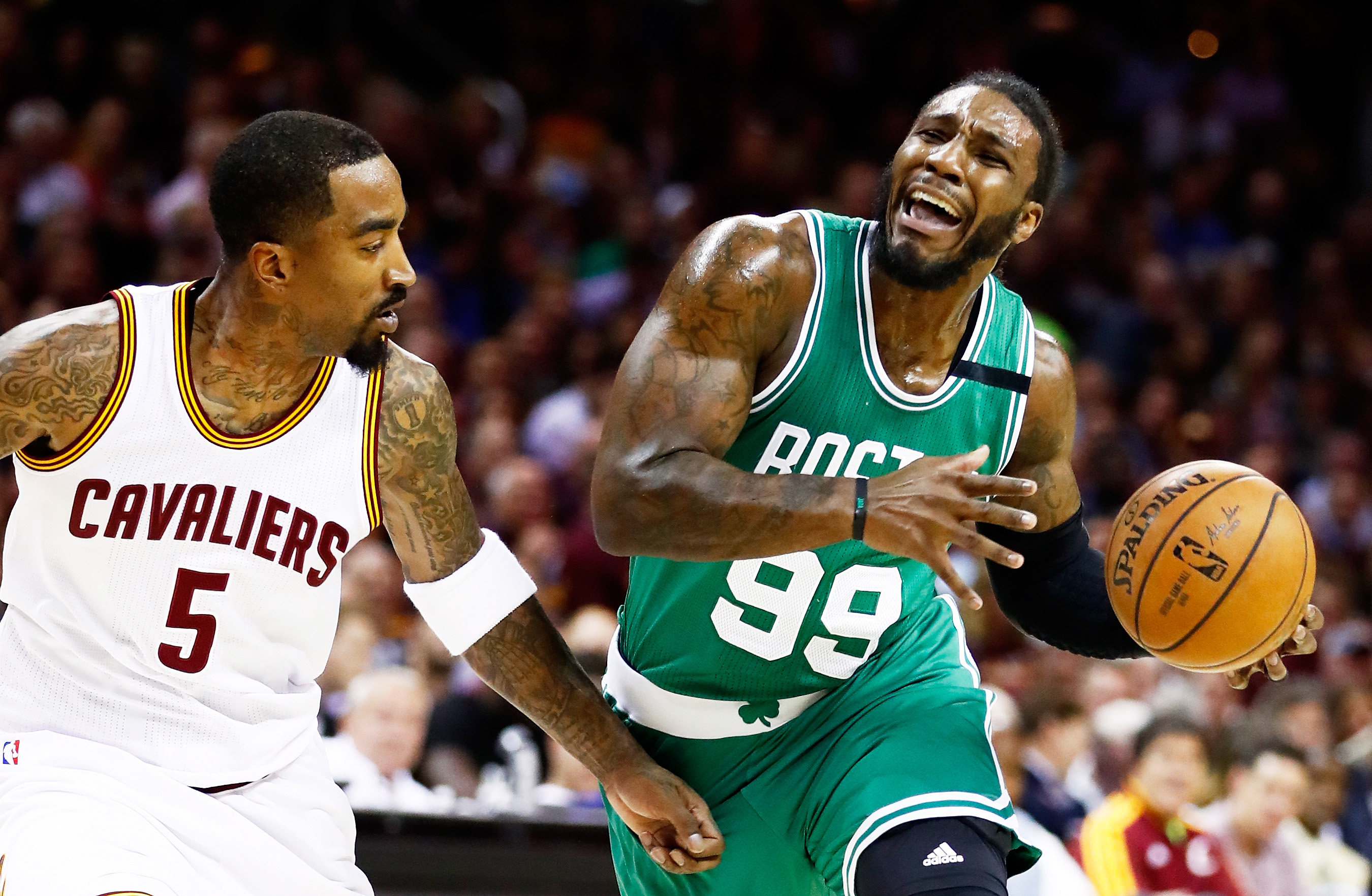 Jae Crowder of the Boston Celtics drives against JR Smith of the Cleveland Cavaliers.