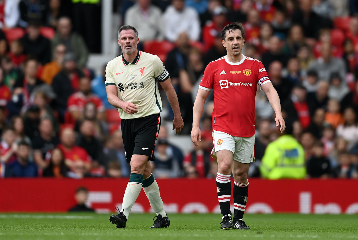 Gary Neville of Manchester United with Liverpool captain Jamie Carragher in 2022. The two pundits got into it on Twitter over Cristiano Ronaldo's transfer request.