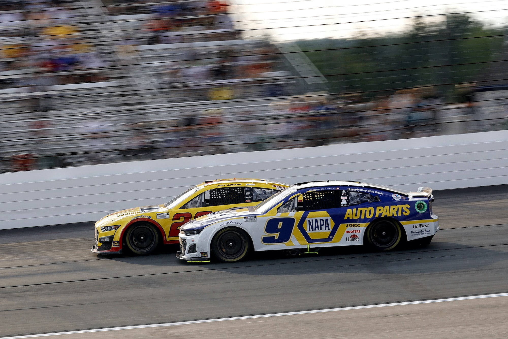 Joey Logano and Chase Elliott race