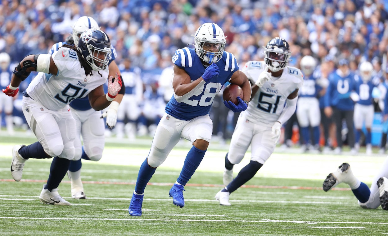 Jonathan Taylor runs the ball against the Titans.