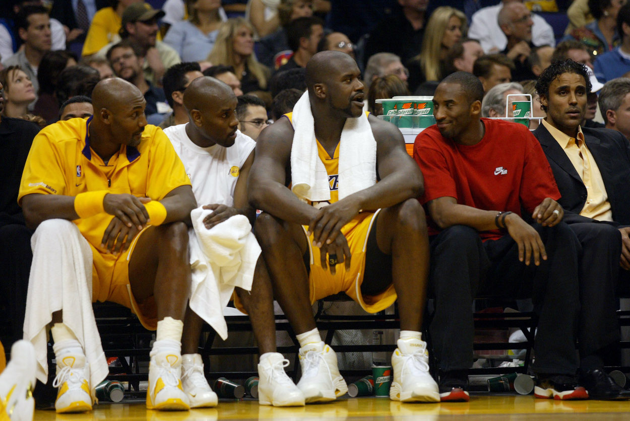 Los Angeles Lakers Karl Malone, Gary Payton, Shaquille O'Neal with a non–uniformed Kobe Bryant watching the game in 2003.