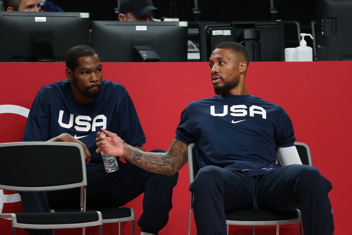 Kevin Durant and Damian Lillard of Team United States talk before an Olympic basketball game in 2021